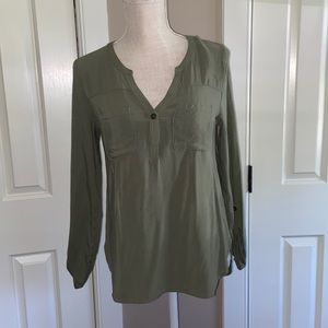A dressier top it’s an army green color. Size small, worn about two times.